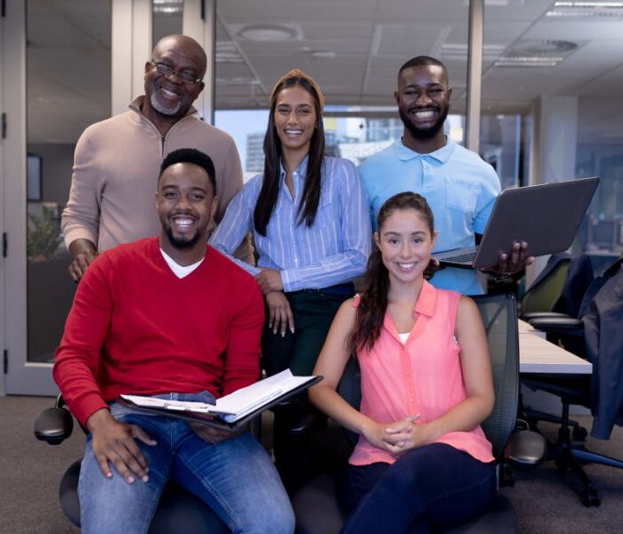 Diverse professional team at a recruitment agency in Aruba smiling in a modern office